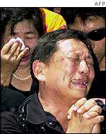 Balinese weep for those killed in the 12 October 2002 bombs