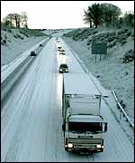 Vehicles on snow covered road