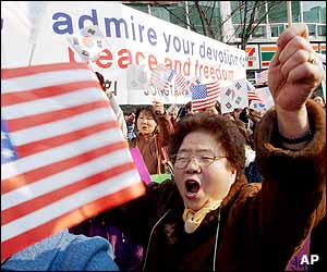 Waving US and South Korean flags, South Korean citizens shout slogans during a pro-US rally to support US military presence in South Korea