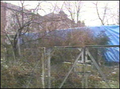 Photo of Police canvas in garden of house in Cricklewood, north west London