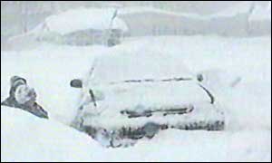 Snow-bound vehicles in street in Sakhalin