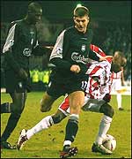 Gerrard muslces his way past Ndlovu