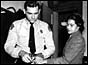 Rosa Parks being fingerprinted in Montgomery, Alabama for violating segregation laws (22/02/1956) - her refusal to move to the back of a bus sparked a bus boycott 