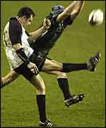 Mark Wilkinson attempts to clear the ball against London Irish