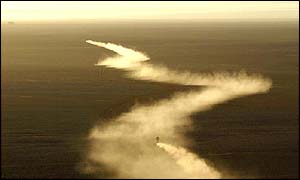 Motorcyclists chase each other through the Libyan desert during the Ghadames-Ghat stage 
