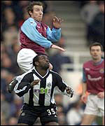 New West ham signing Lee Bowyer climbs above Olivier Bernard at Upton Park