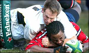 Gloucester's Marcel Garvey beats Ryan Pickering to score