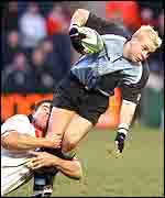 Ulster skipper Andy ward tackles Cardiff scrum-half Robert Powell