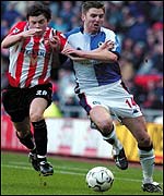 Sunderland's John Oster (left) and Nils Eric Johansson of Blackburn battle for possession