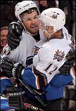 Jaromir Jagr is congratulated by Peter Bondra who also scored two goals