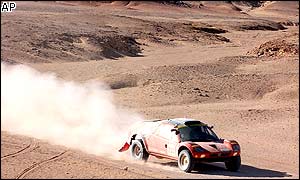 Germany's Jutta Kleinschmidt drives her Volkswagen Desert Nardo through the tough tenth stage