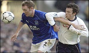 Steve Watson shields the ball from Simon Davies