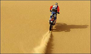 Spanish motorbike rider Marc Coma kicks up sand in stage eleven of the Dakar rally 