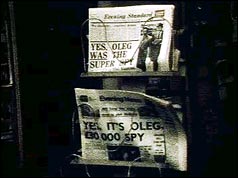 Newstand newspapers headlining the Oleg story
