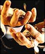 A hand catching money