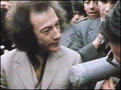 Ronald Milhench talking to press