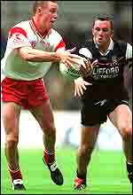 Tyrone defender Cormac McGinley (left)