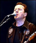 Strummer playing live with The Mescaleros