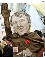 Belarusian demonstrators carry a picture of President Lukashenka 