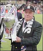 Mohamed Al Fayed lifts the Division One championship trophy