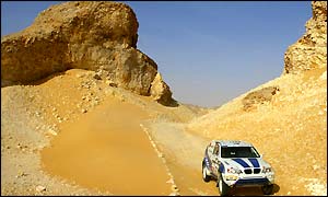 France's Luc Alphand steers his BMW over the difficult terrain to finish second on stage 13