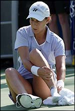 Monica Seles receives treatment for an ankle injury in the first set
