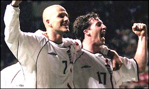 Robbie Fowler celebrates his goal against Albania in September 2001 with England captain David Beckham