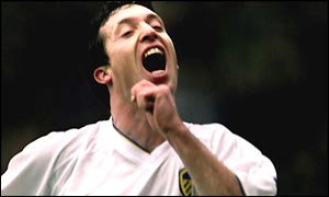 Robbie Fowler celebrates scoring for Leeds