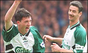 Robbie Fowler celebrates only his second league goal for Liverpool with Ian Rush