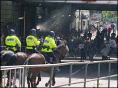 Mounted police confront hooligans