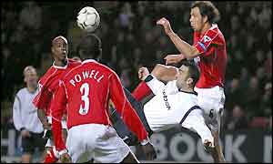 Youri Djorkaeff scores with an overhead kick