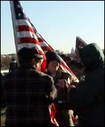 A smaller group of pro-war demonstrators unfurled the flag