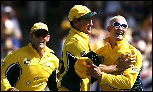 Michael Clarke celebrates with team-mates