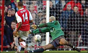 Thierry Henry strikes the ball past David James for his third goal