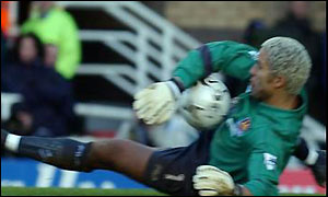 David James makes one of a number of saves during the first half