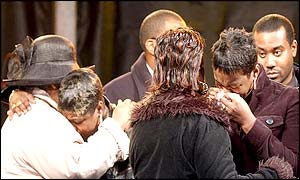 Grieving relatives including Beverley Thomas (centre right), mother of Charlene Ellis