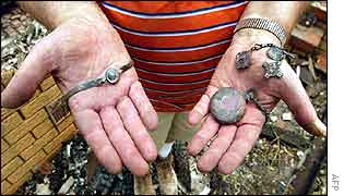 Canberra man shows family heirlooms charred by fire