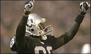 Jerry Rice of the Oakland Raiders celebrates a field goal