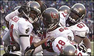 Tampa Bay Buccaneers receiver Keyshawn Johnson is swarmed by team-mates 
