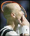 Andre Agassi celebrates victory against Sebastien Grosjean