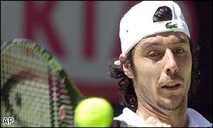 Sebastien Grosjean struggles to make the returns off Agassi's confident serve