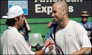 Agassi shakes Grosjean's hand as the American wins easily