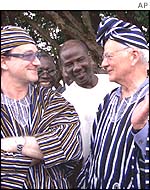 Bono (left) with Paul O'Neill in Ghana in May 2002