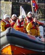 The lifeboat and crew carrying the slate