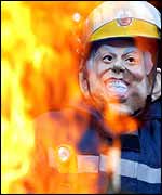 Firefighters at Manchester Fire Station wearing Tony Blair masks