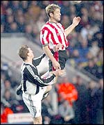 James Beattie climbs above Newcastle defender Stephen Caldwell
