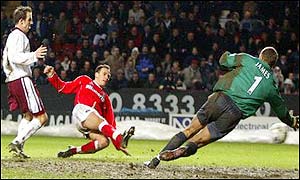 Radostin Kishishev puts the game out of reach for the Hammers and Sinclair's 90-minute strike is only a consolation goal