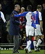 Andy Cole congratulates Sir Alex Ferguson