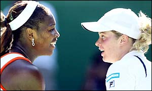 Serena Williams is congratulated at the net by beaten semi-finalist Kim Clijsters
