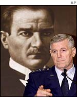 US Chairman of the Joint Chiefs, General Myers, in front of a portrait of Kemal Ataturk